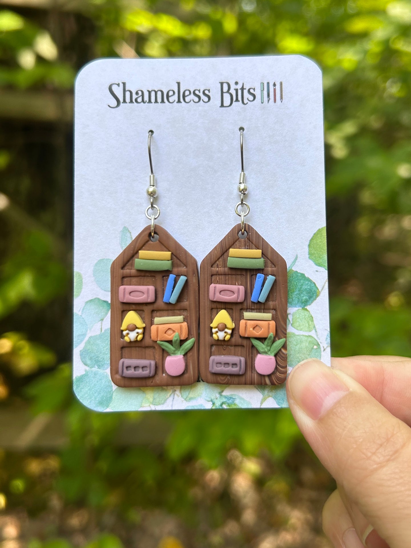 Wooden Bookcase 1 (yellow gnome/pink vase with plant)